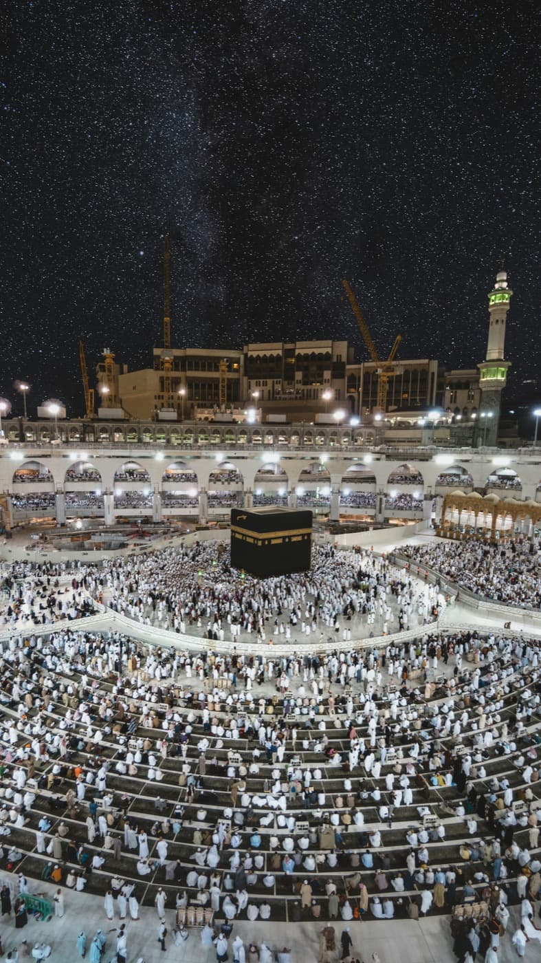 Pilgrims in prayer around the Kaaba at night, Masjid al-Haram